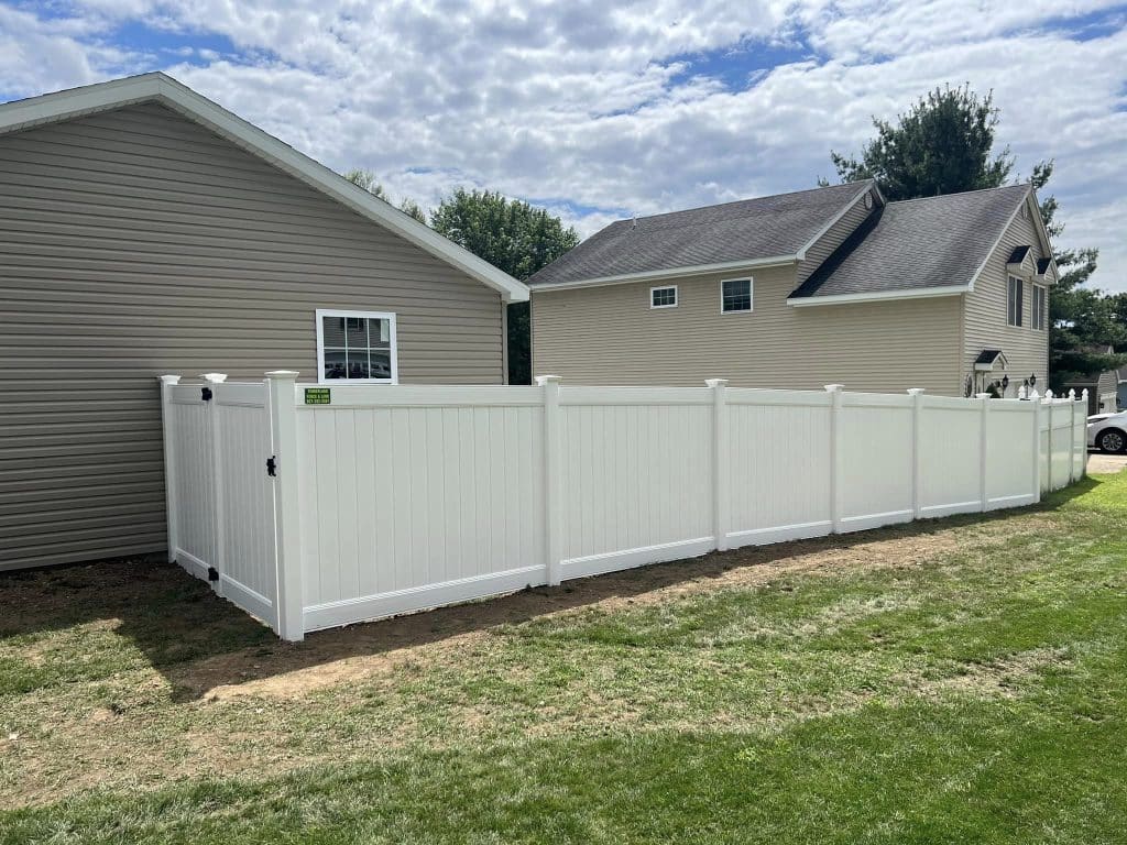 White privacy vinyl fence in residential fencing area